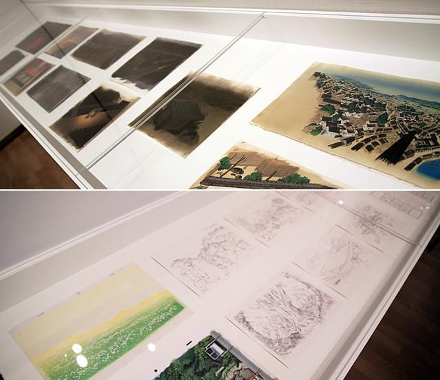 会場には設定画、イメージボード、絵コンテなど関連資料も （上）「火要鎮」（下）「おおかみこどもの雨と雪」の展示